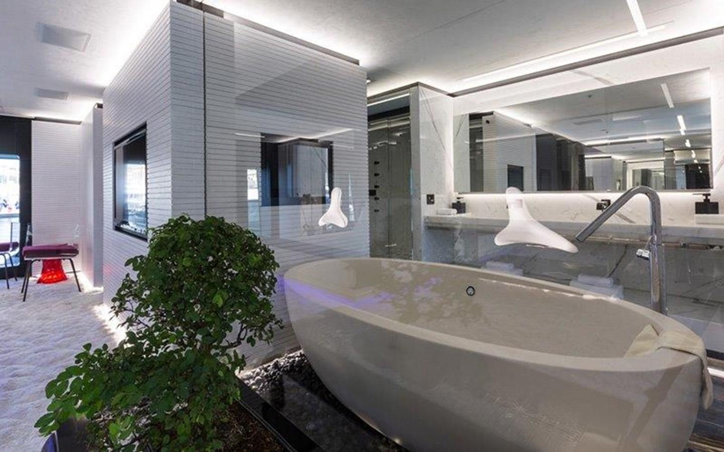 a large jacuzzi in a room aboard OCEAN PARADISE Yacht for Sale