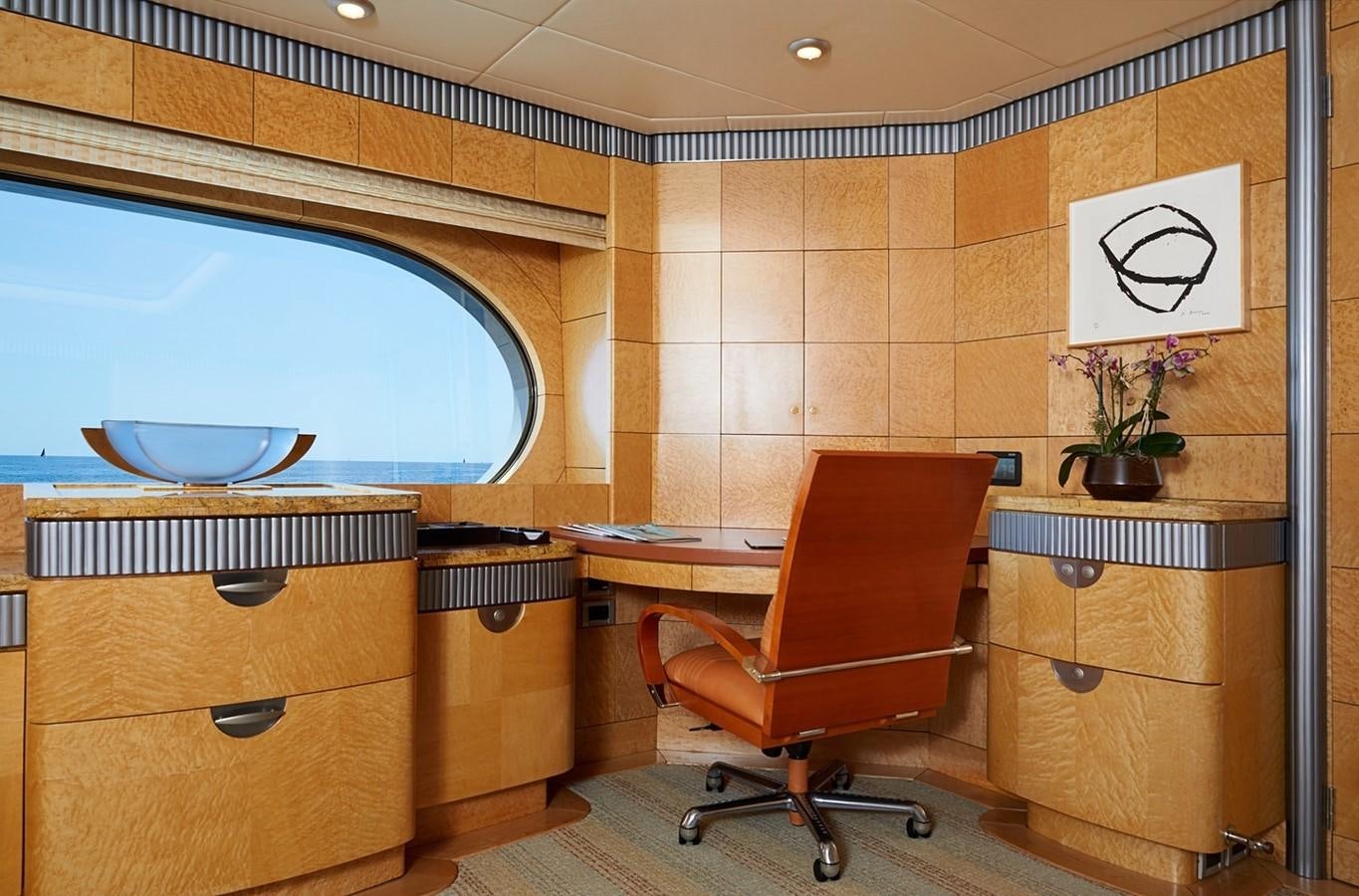 a room with a desk and a chair aboard FORTUNATE SUN Yacht for Sale