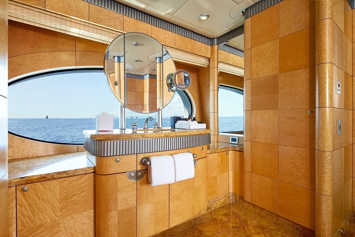 a bathroom with a large mirror aboard FORTUNATE SUN Yacht for Sale
