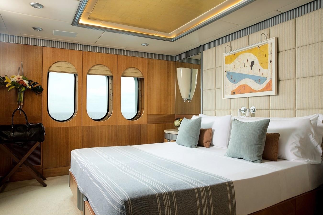 a bed with pillows and pillows aboard FORTUNATE SUN Yacht for Sale