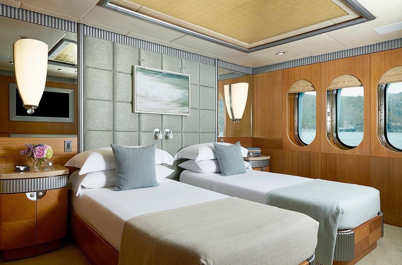 a room with two beds aboard FORTUNATE SUN Yacht for Sale