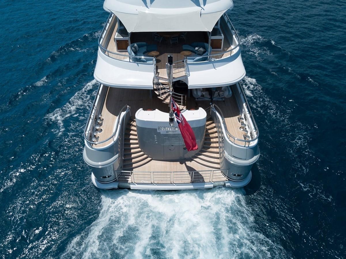 a white car on the water aboard FORTUNATE SUN Yacht for Sale