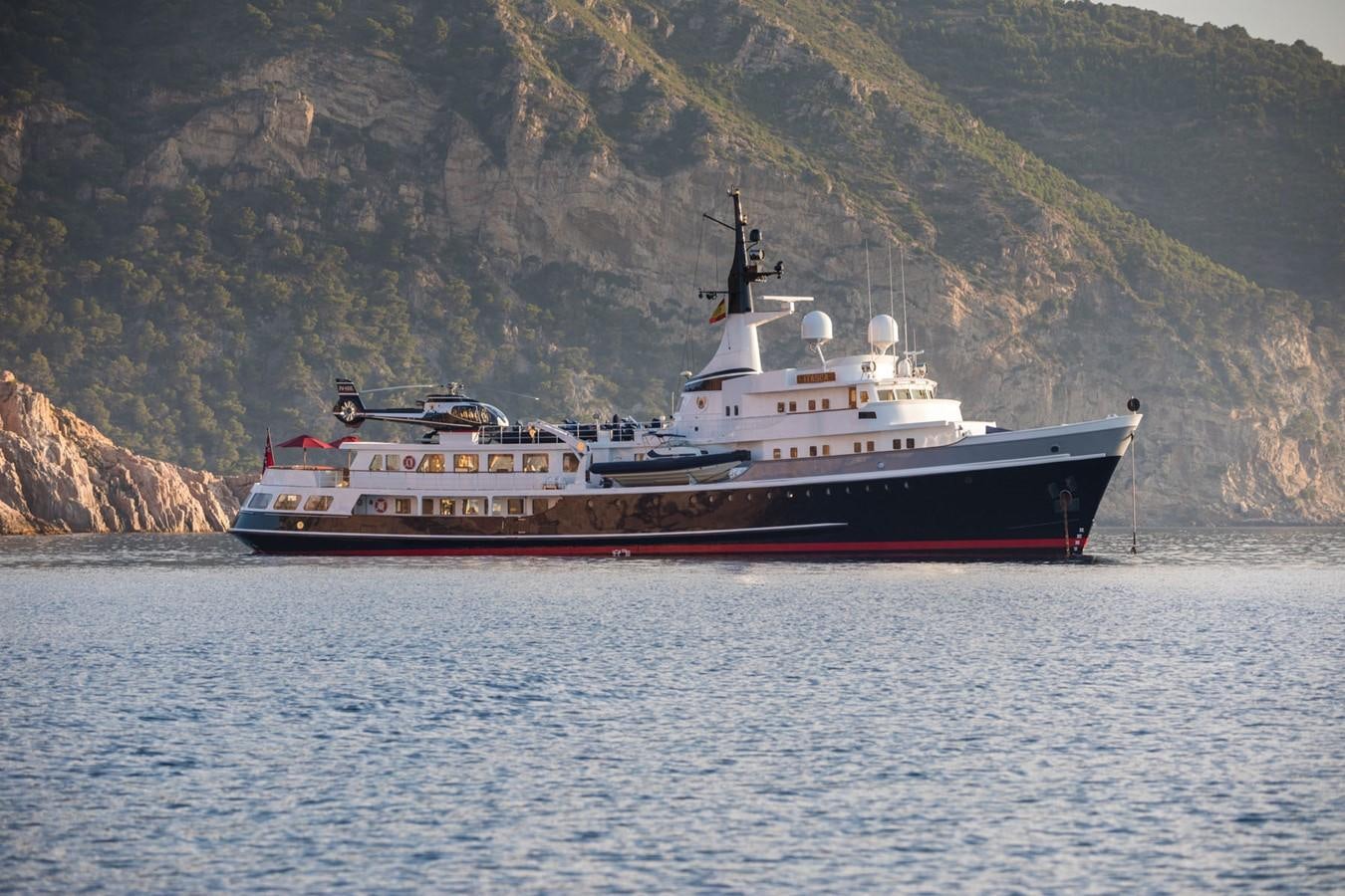 a large ship in the water aboard ITASCA Yacht for Sale