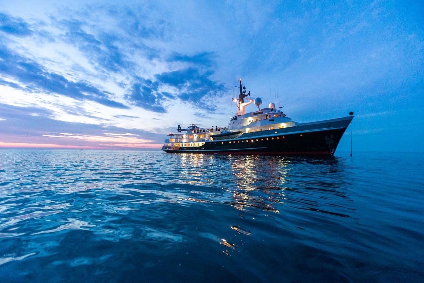 a large ship in the water aboard ITASCA Yacht for Sale