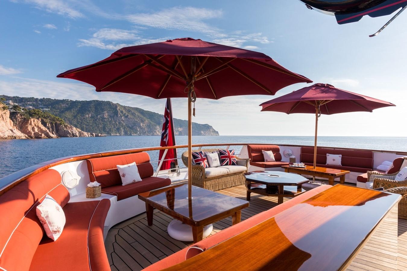 a boat with umbrellas on it aboard ITASCA Yacht for Sale