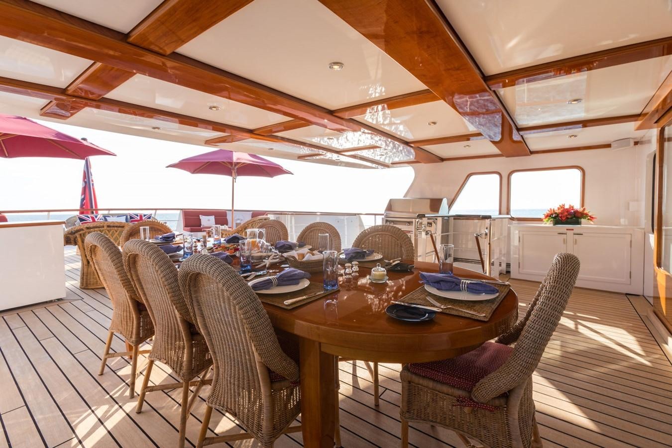 a dining room with a table and chairs aboard ITASCA Yacht for Sale