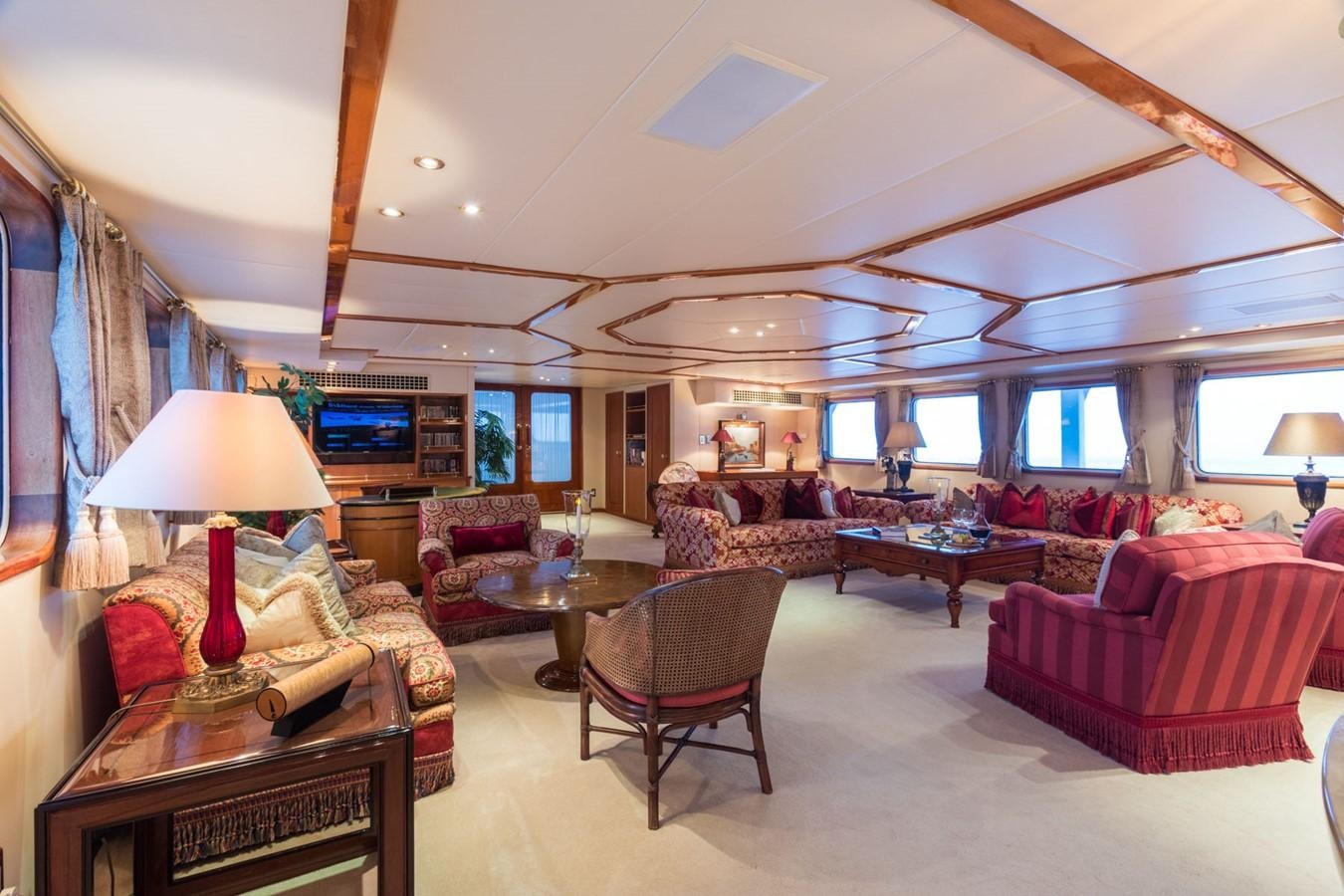 a living room with a large window aboard ITASCA Yacht for Sale