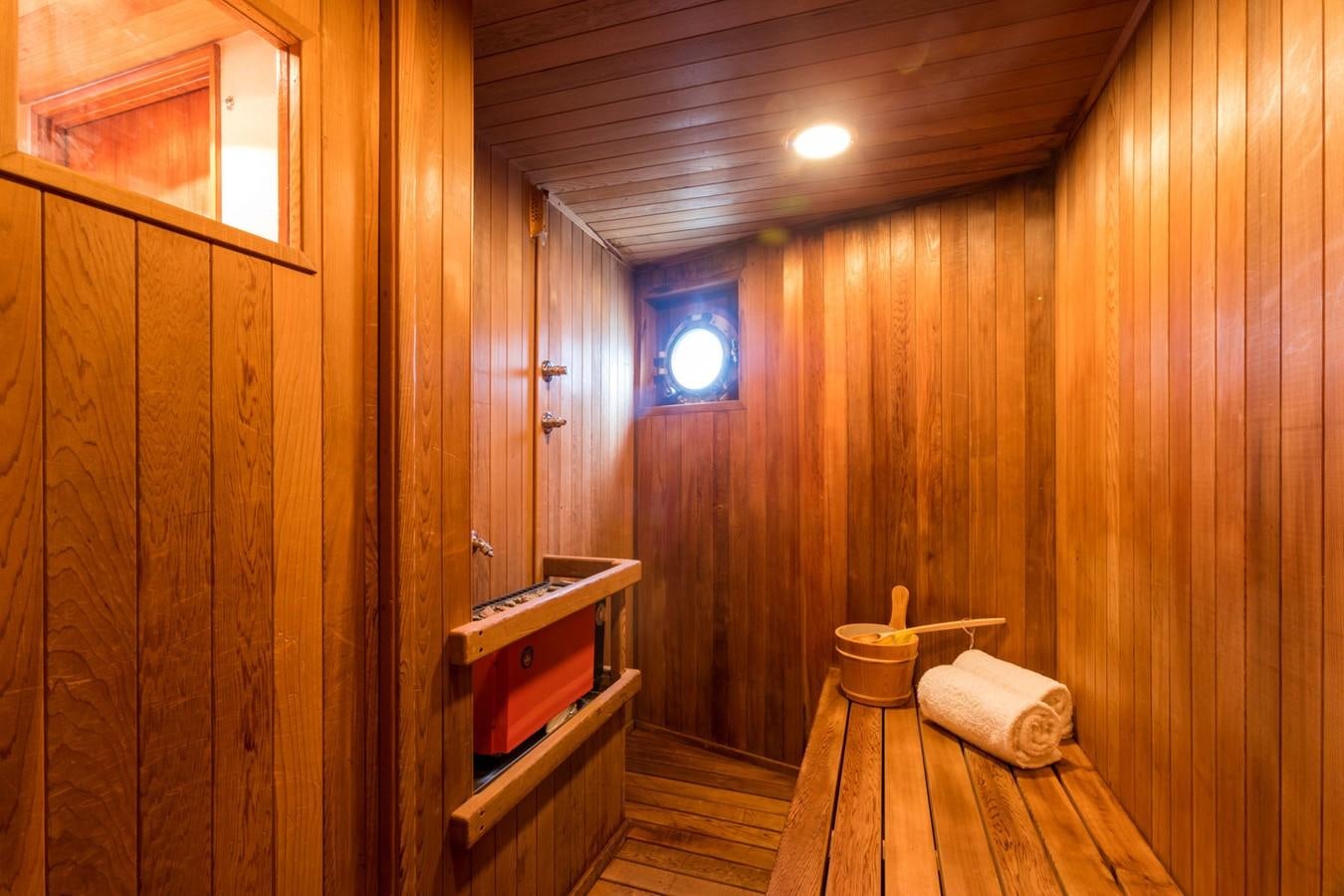 a wooden cabin with a bench aboard ITASCA Yacht for Sale