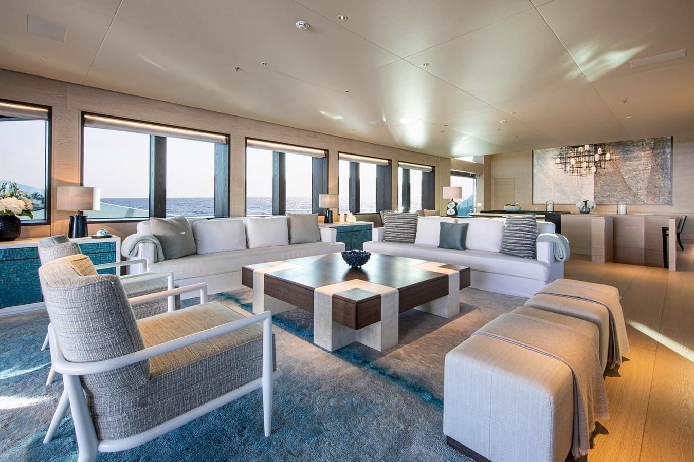 a living room with a couch and a coffee table aboard SANAM Yacht for Sale