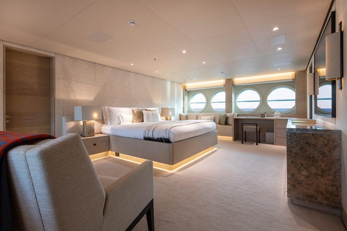 a large room with a bed and a couch aboard SANAM Yacht for Sale