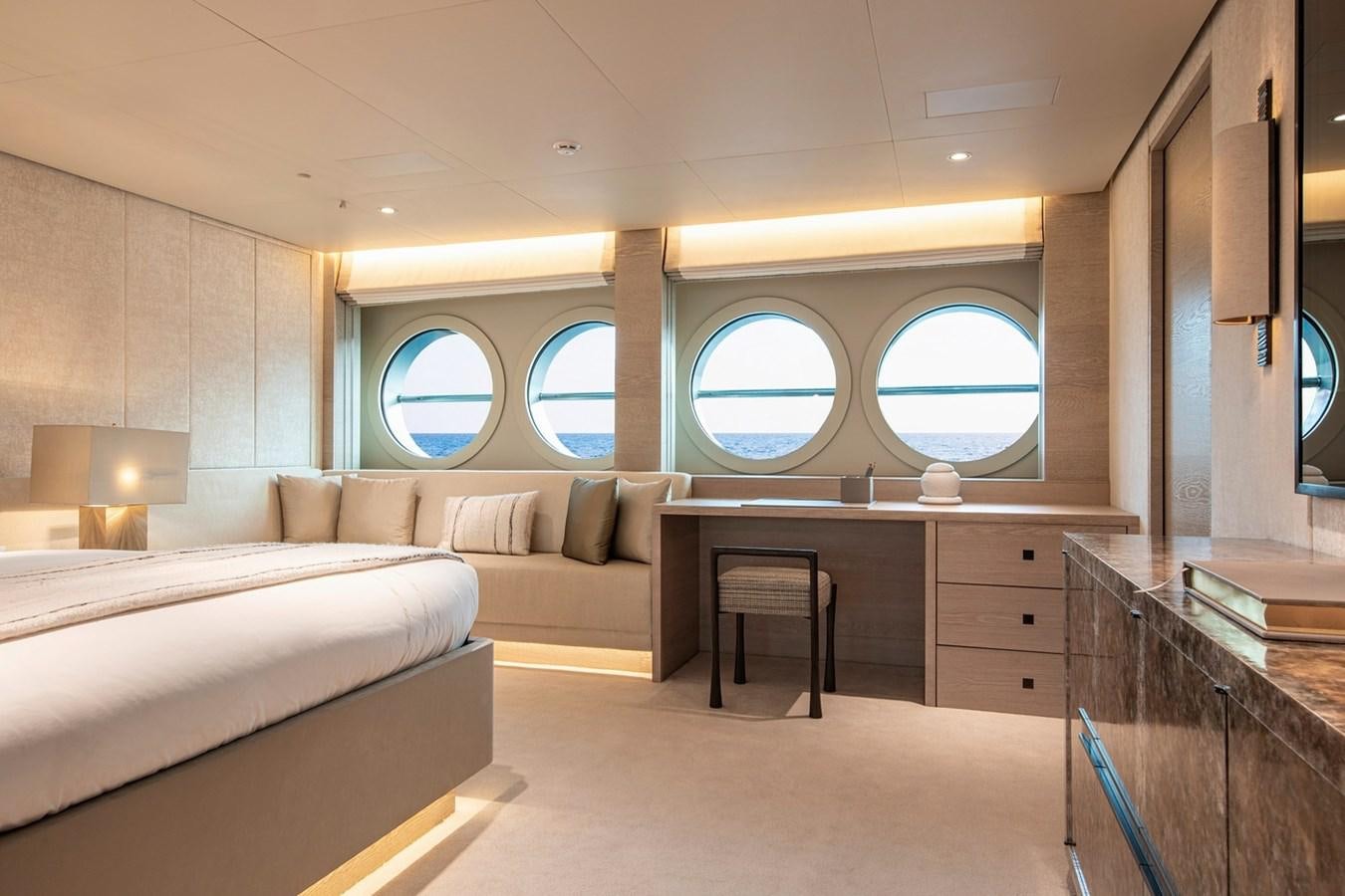 a room with a bed and a desk aboard SANAM Yacht for Sale
