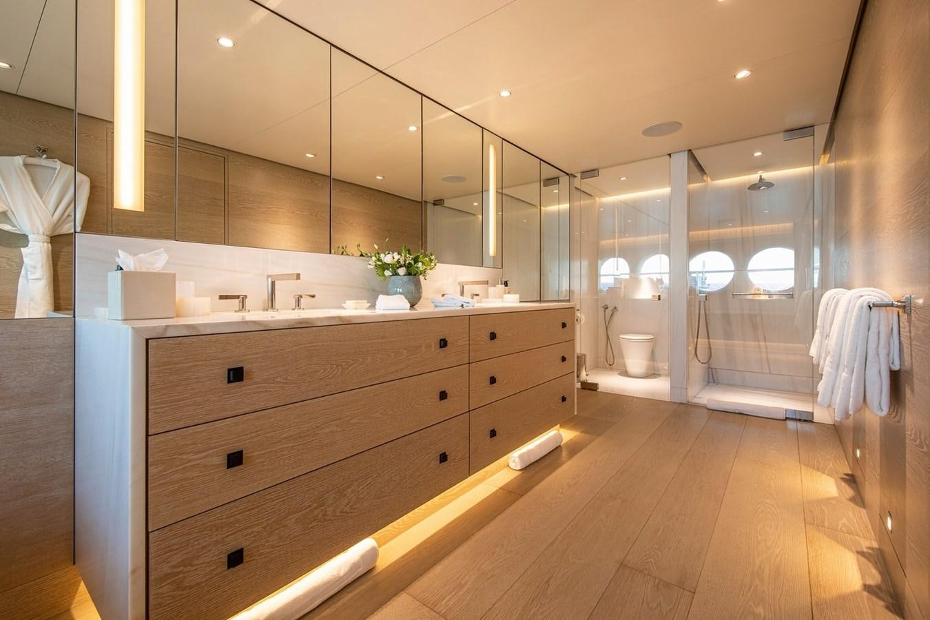 a bathroom with a large mirror aboard SANAM Yacht for Sale