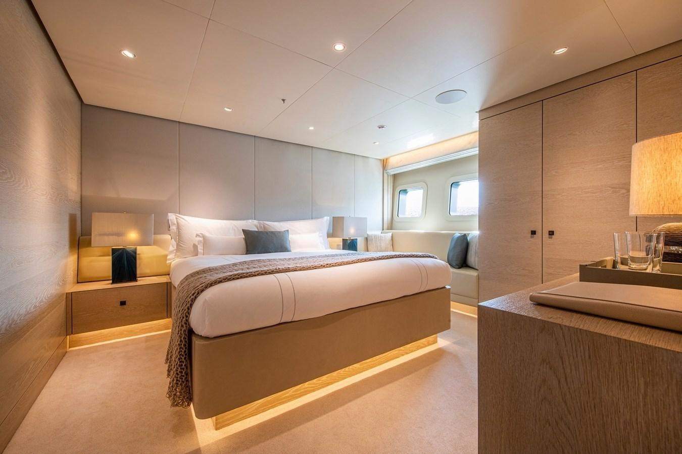 a room with a bed and a desk aboard SANAM Yacht for Sale
