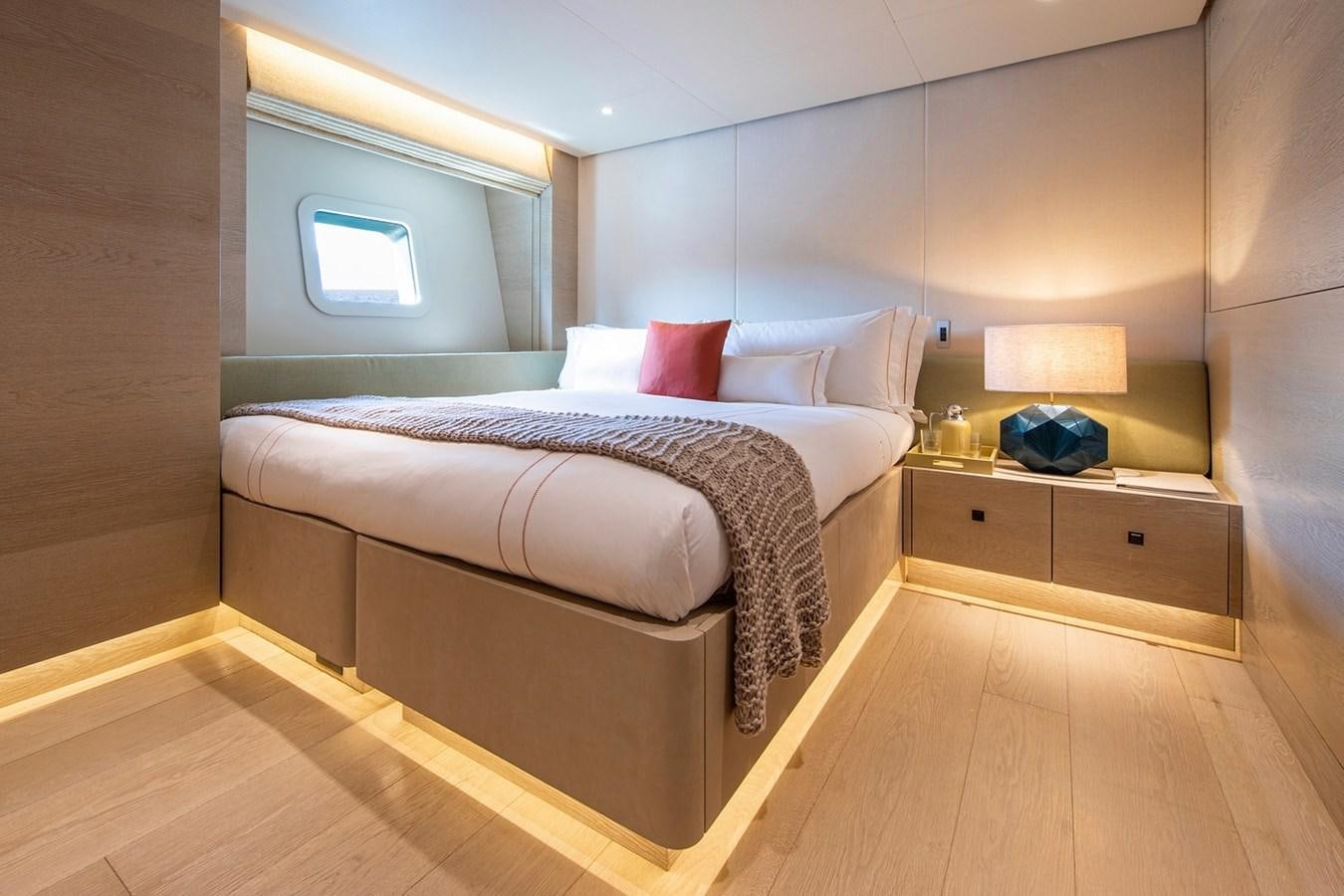 a bed in a room aboard SANAM Yacht for Sale