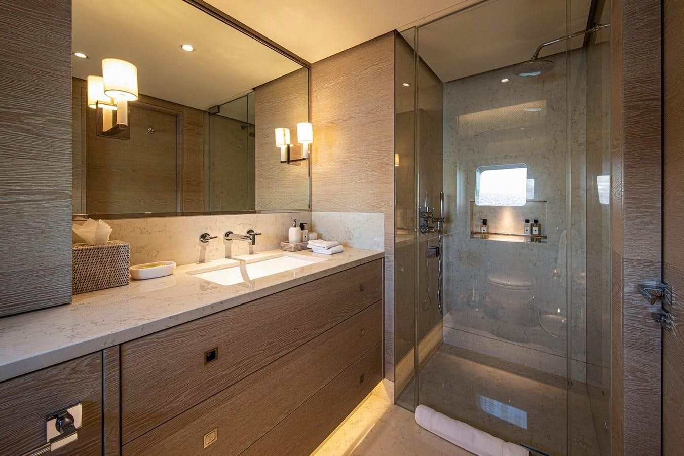 a bathroom with a large mirror aboard SANAM Yacht for Sale