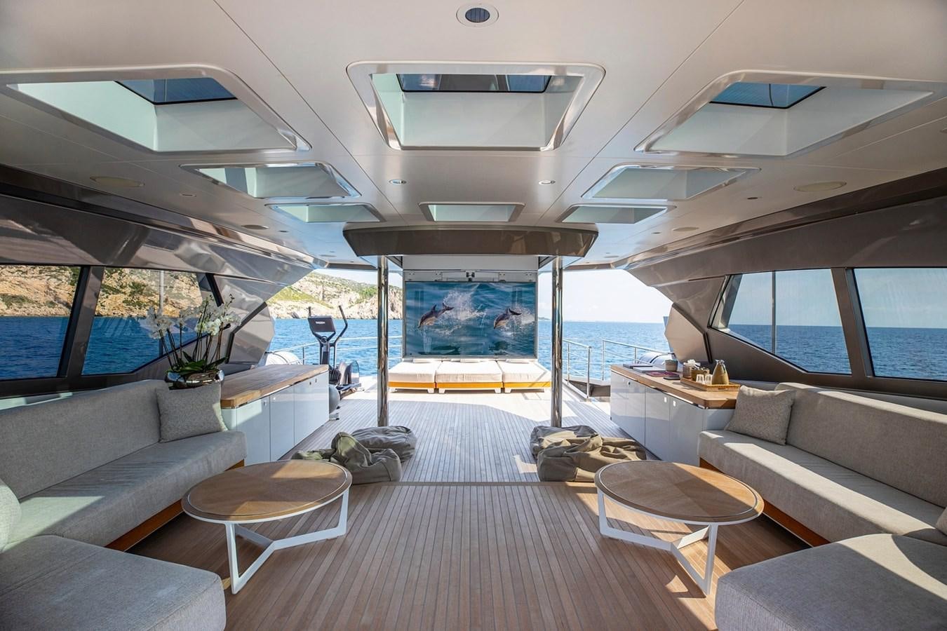a room with a couch and a table and a window aboard SANAM Yacht for Sale