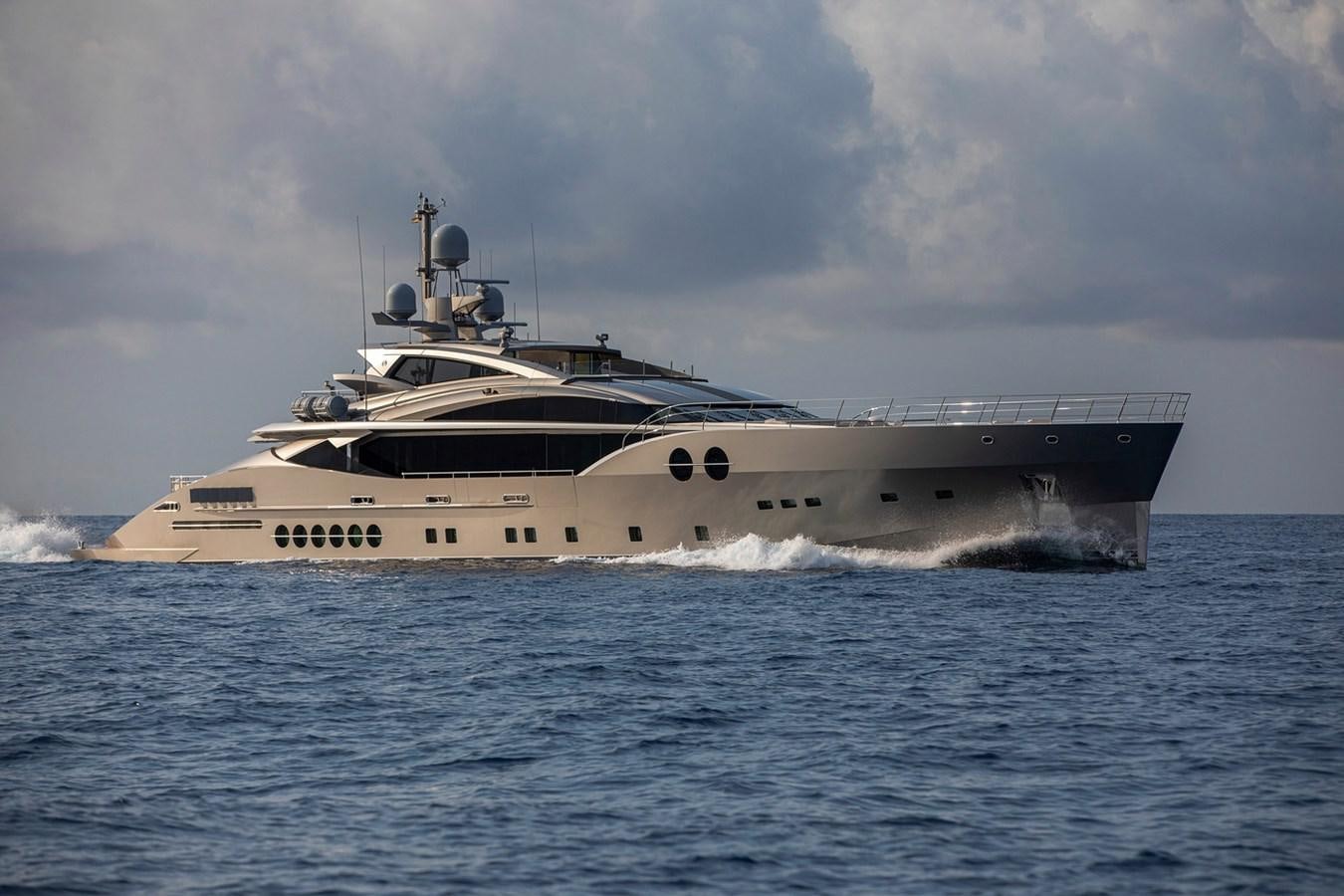 a large military ship in the water aboard SANAM Yacht for Sale