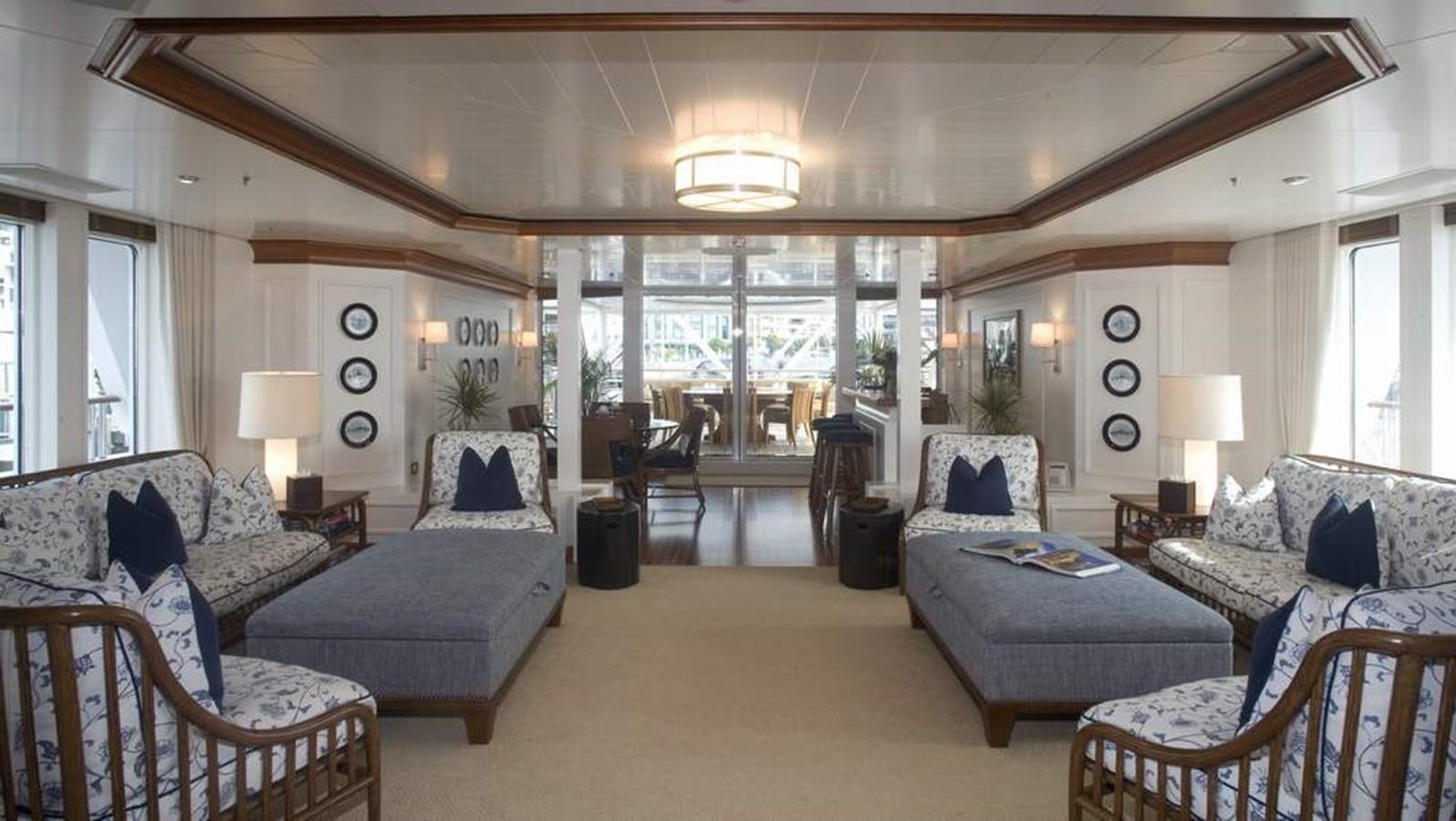 a living room with a large glass door aboard HADIA Yacht for Sale