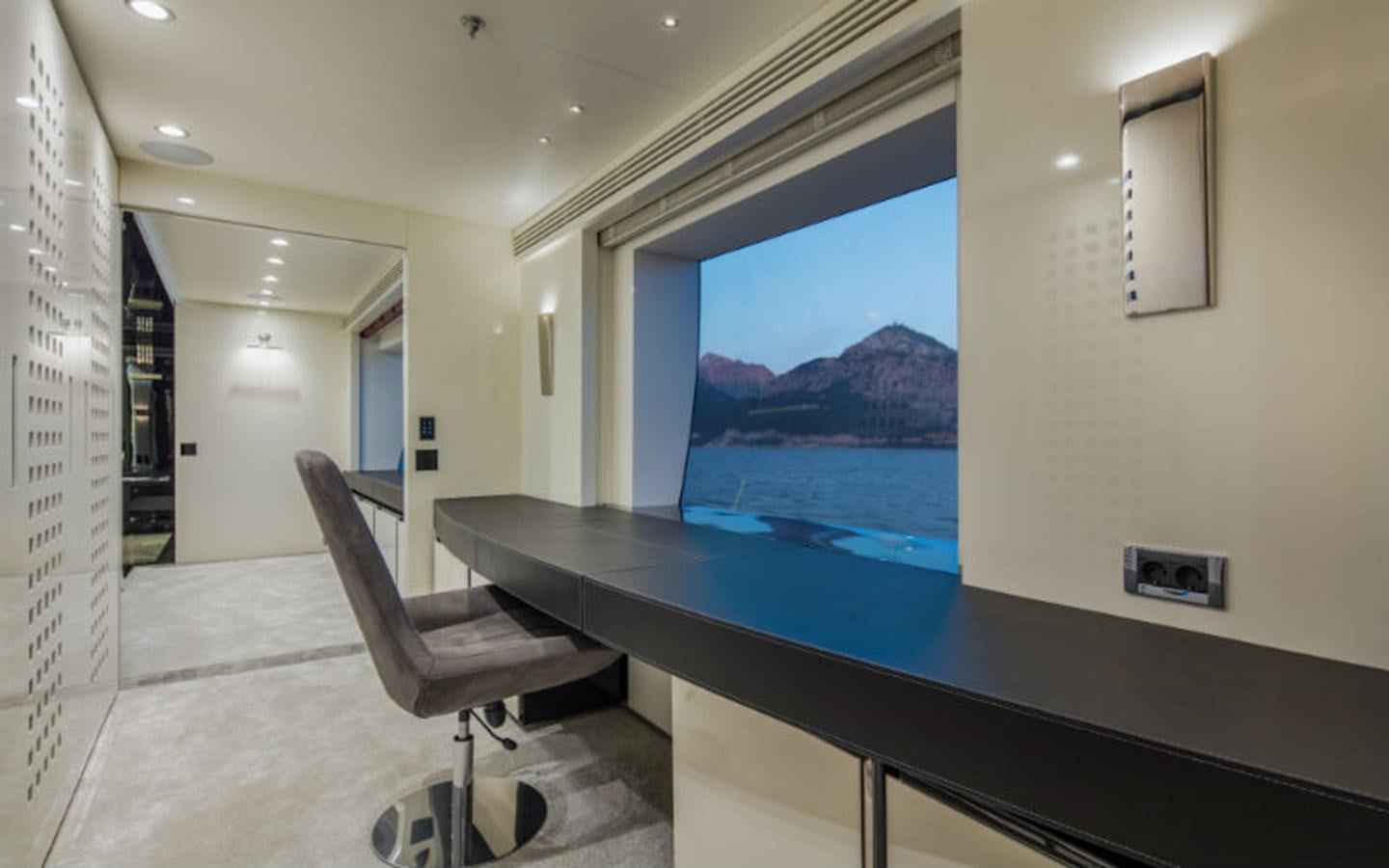 a room with a desk and a tv aboard EUPHORIA Yacht for Sale