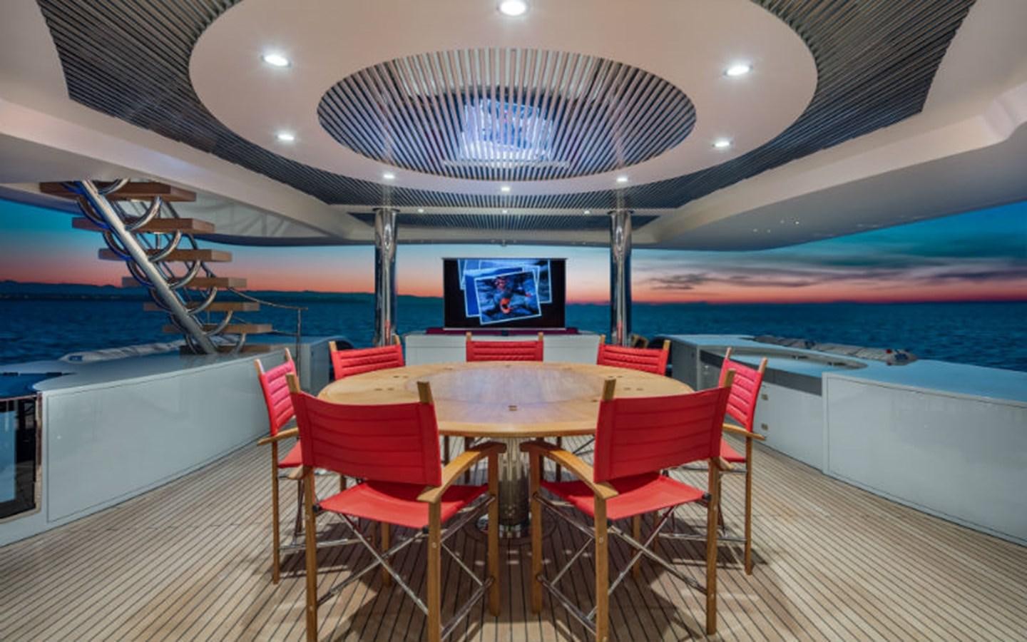 a room with a table and chairs aboard EUPHORIA Yacht for Sale