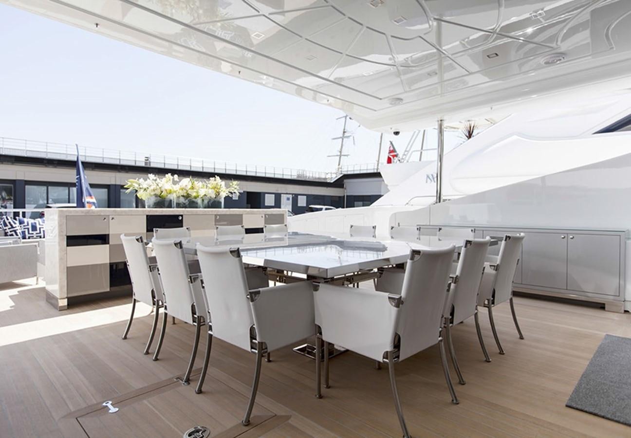 a room with tables and chairs aboard APRICITY Yacht for Sale