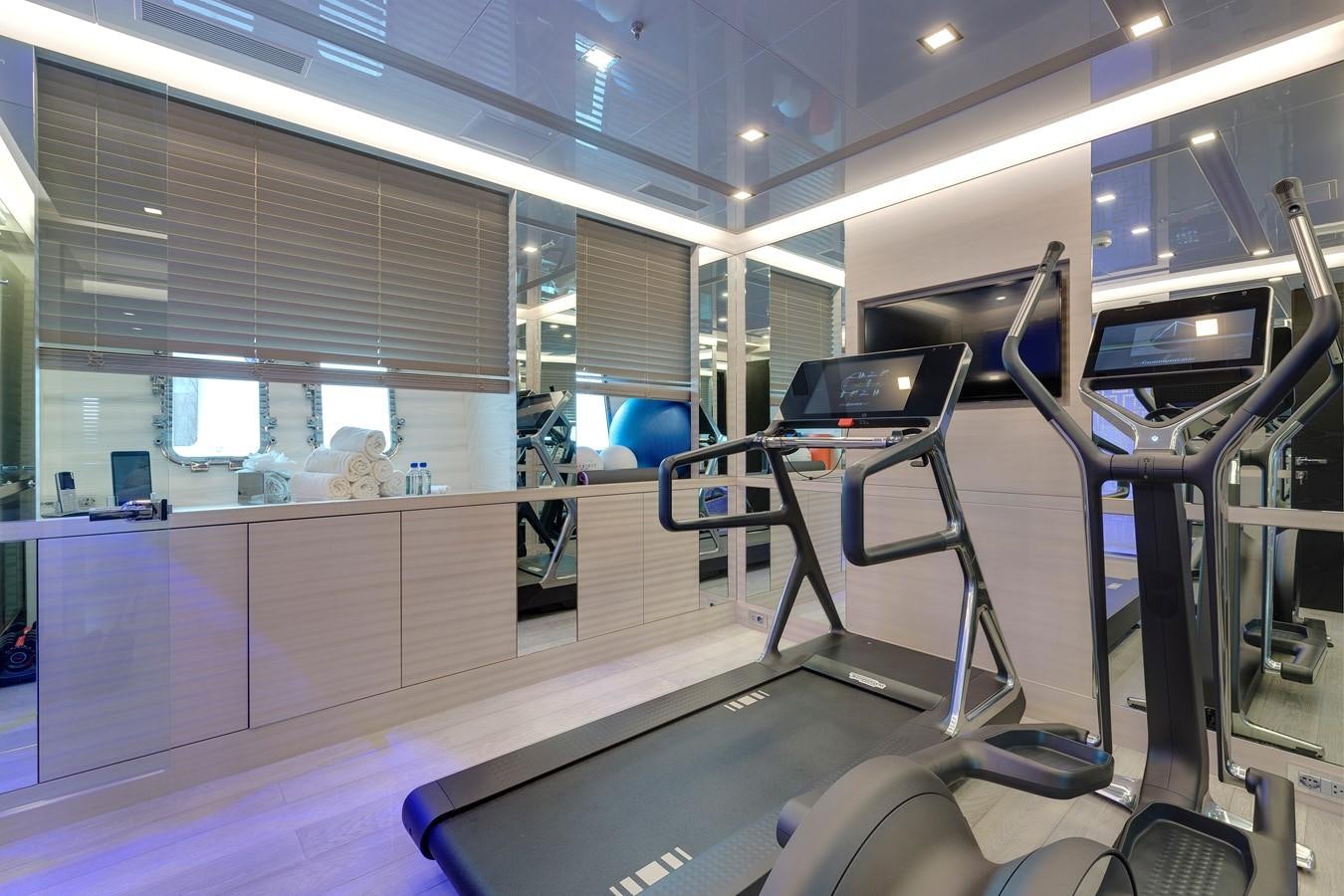 a gym with exercise equipment aboard APRICITY Yacht for Sale