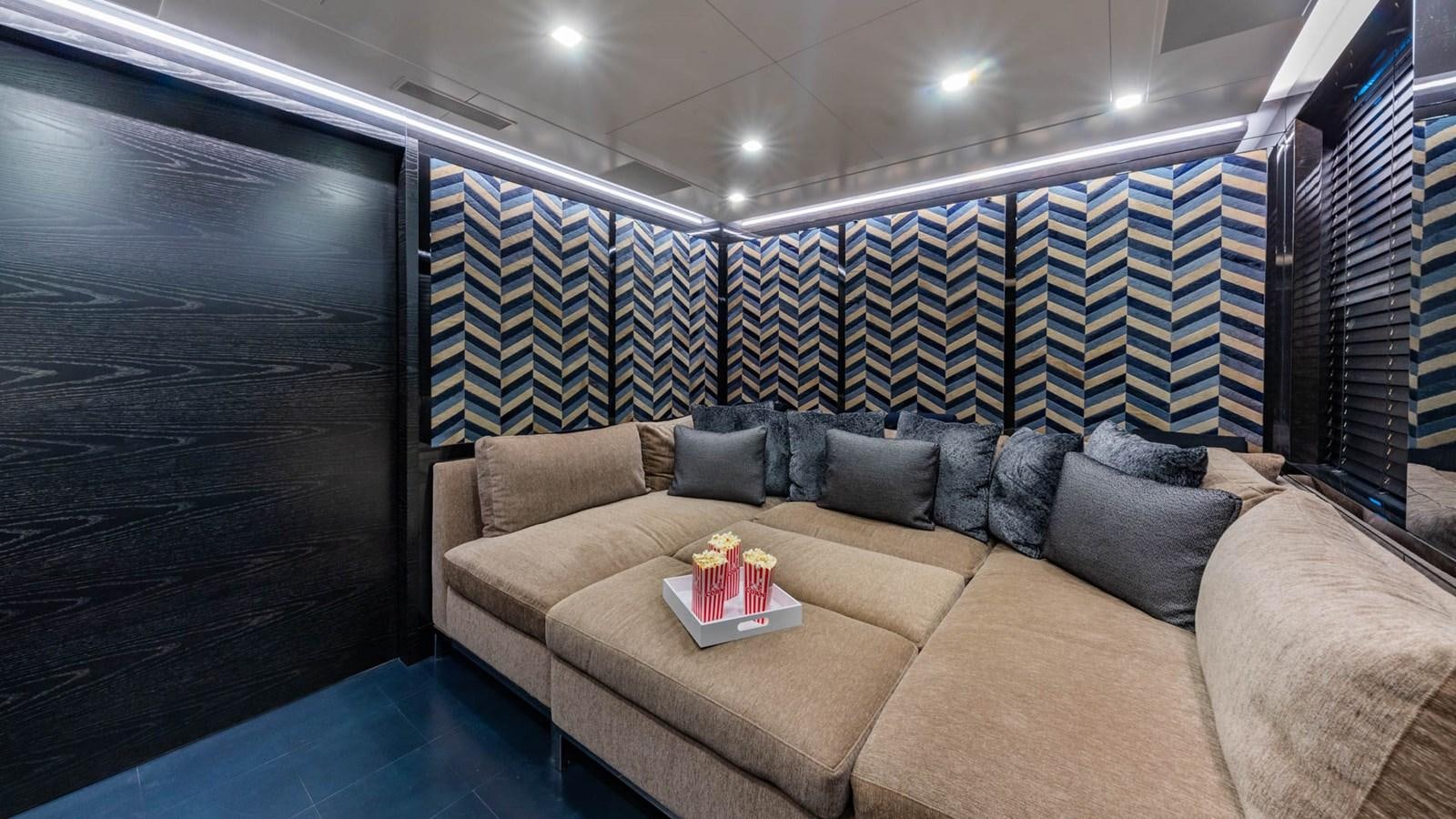 a couch with a coffee table aboard APRICITY Yacht for Sale