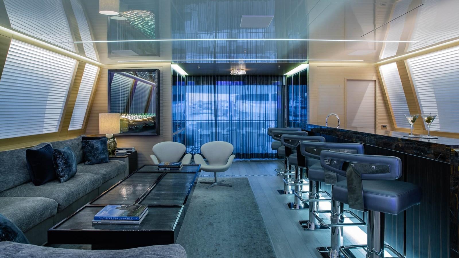 a living room with a couch and a coffee table aboard APRICITY Yacht for Sale