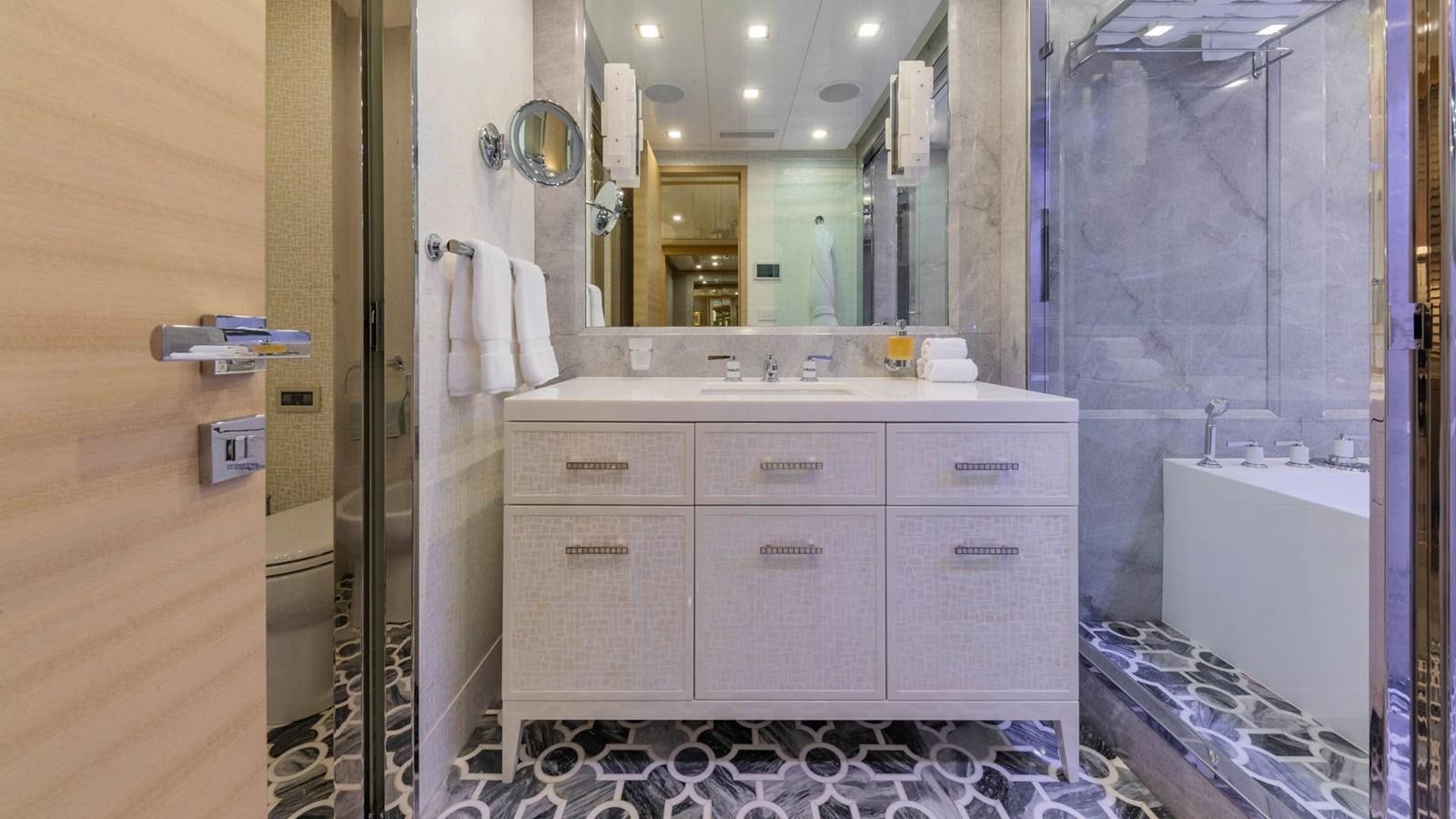 a bathroom with a sink and a mirror aboard APRICITY Yacht for Sale