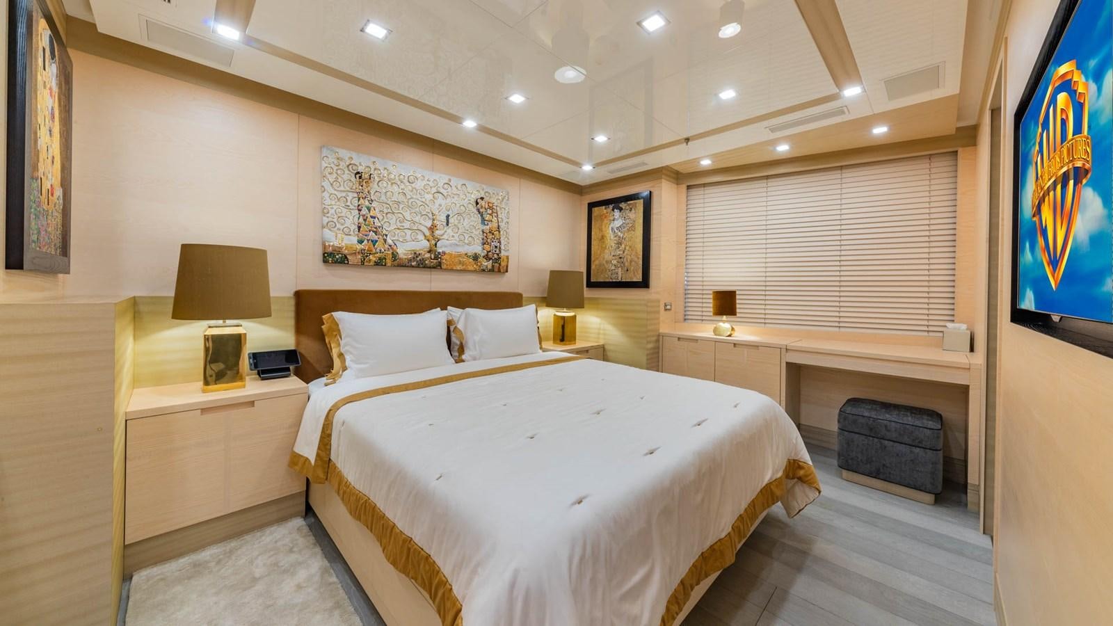 a room with a bed and a television aboard APRICITY Yacht for Sale
