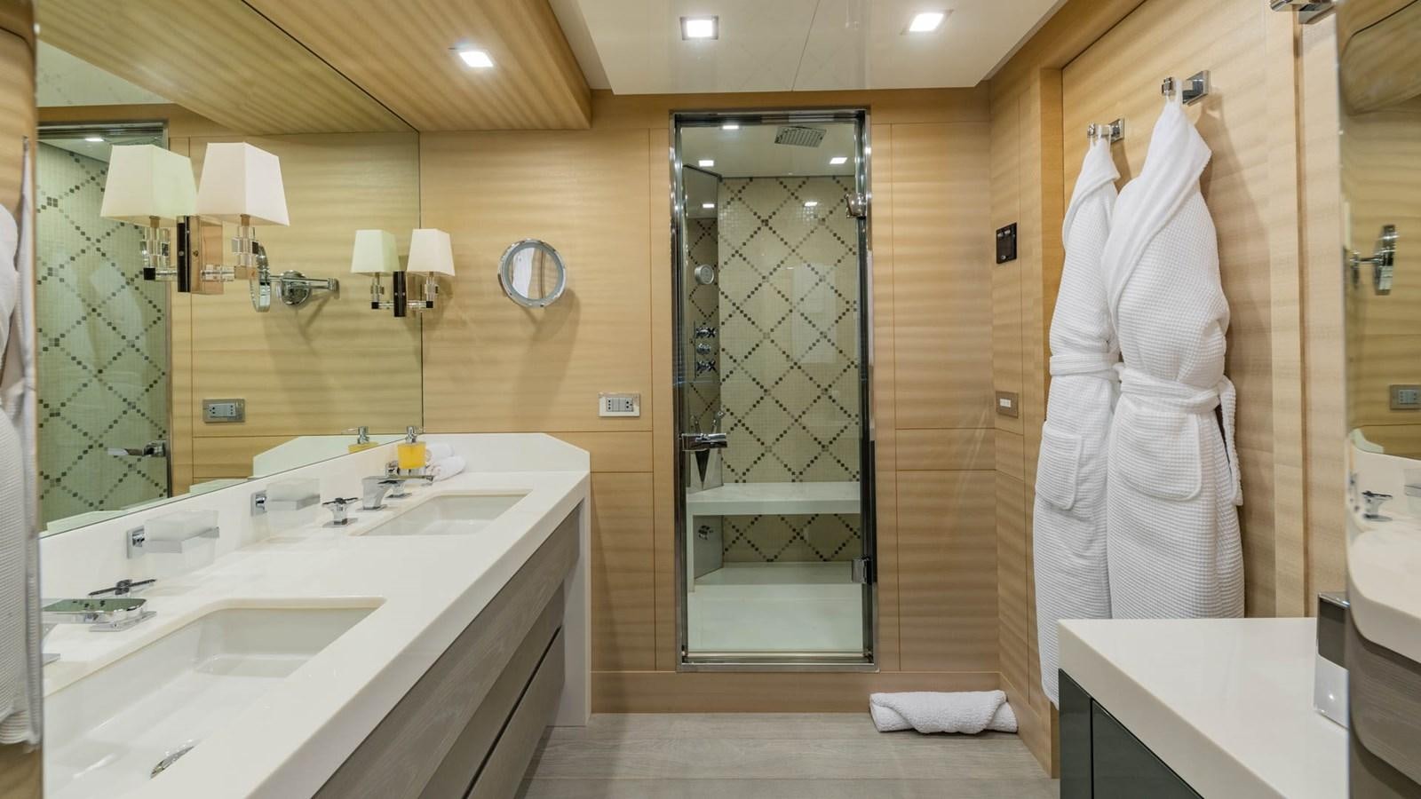 a bathroom with a glass shower aboard APRICITY Yacht for Sale