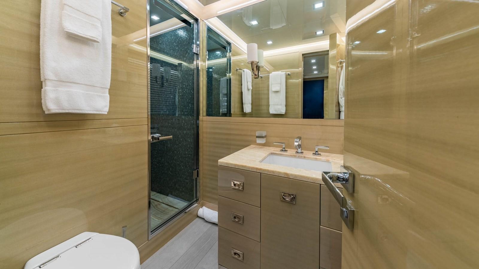 a bathroom with a sink and a mirror aboard APRICITY Yacht for Sale