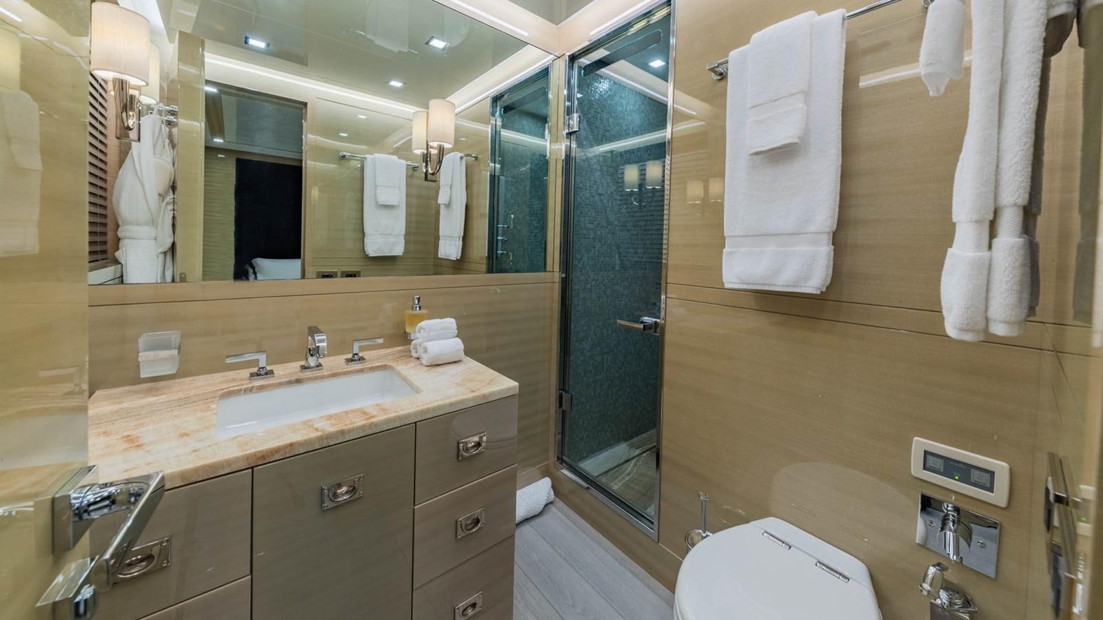 a bathroom with a large mirror aboard APRICITY Yacht for Sale