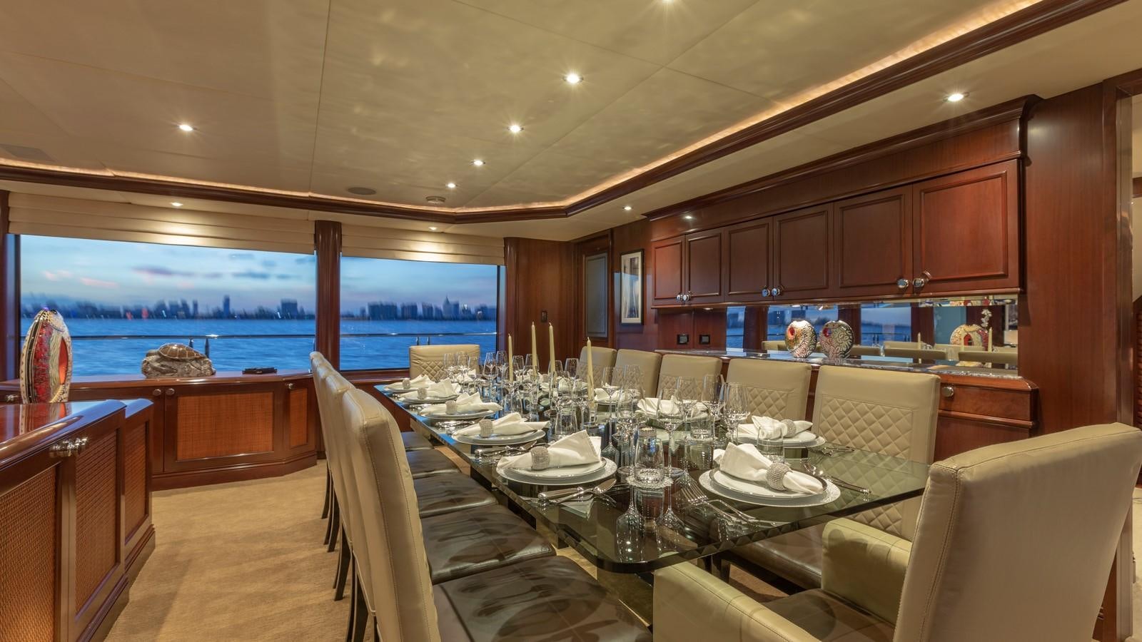 a dining room with a large table aboard GLAZE Yacht for Sale