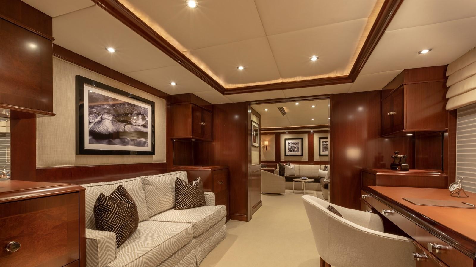 a room with a couch and a table and a television aboard GLAZE Yacht for Sale