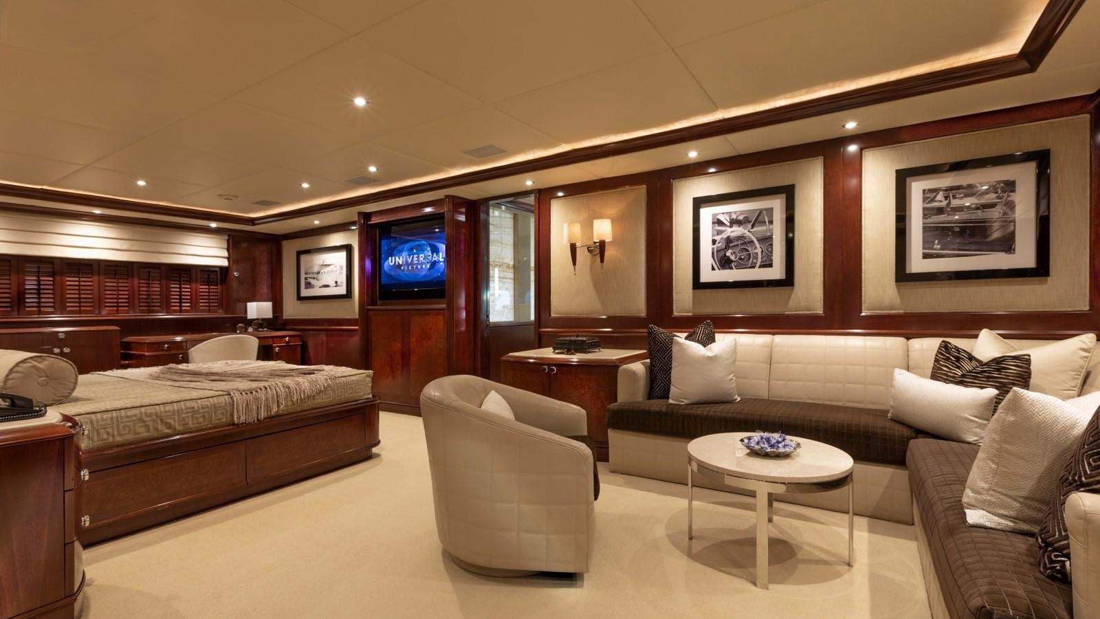 a large hotel room with a bed and a tv aboard GLAZE Yacht for Sale
