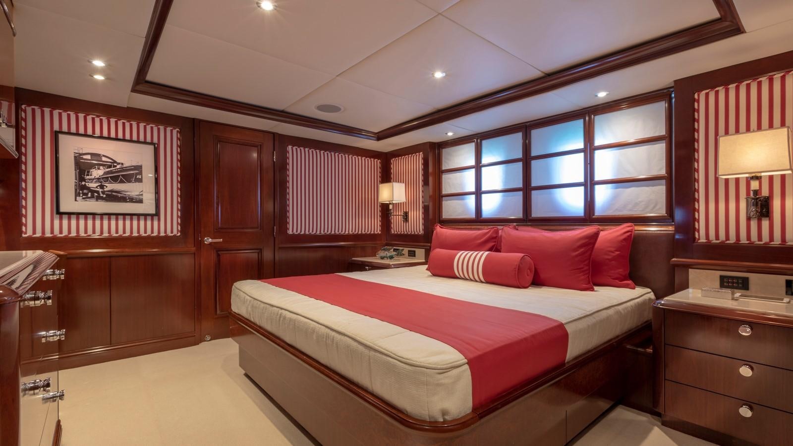 a room with a bed and a desk aboard GLAZE Yacht for Sale