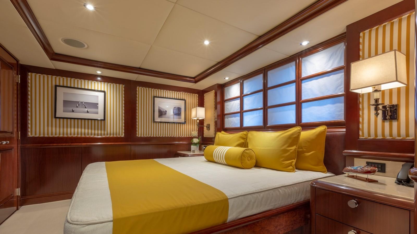 a room with a bed and a desk aboard GLAZE Yacht for Sale