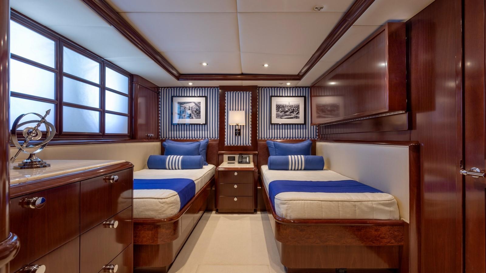 a room with a bed and a mirror aboard GLAZE Yacht for Sale