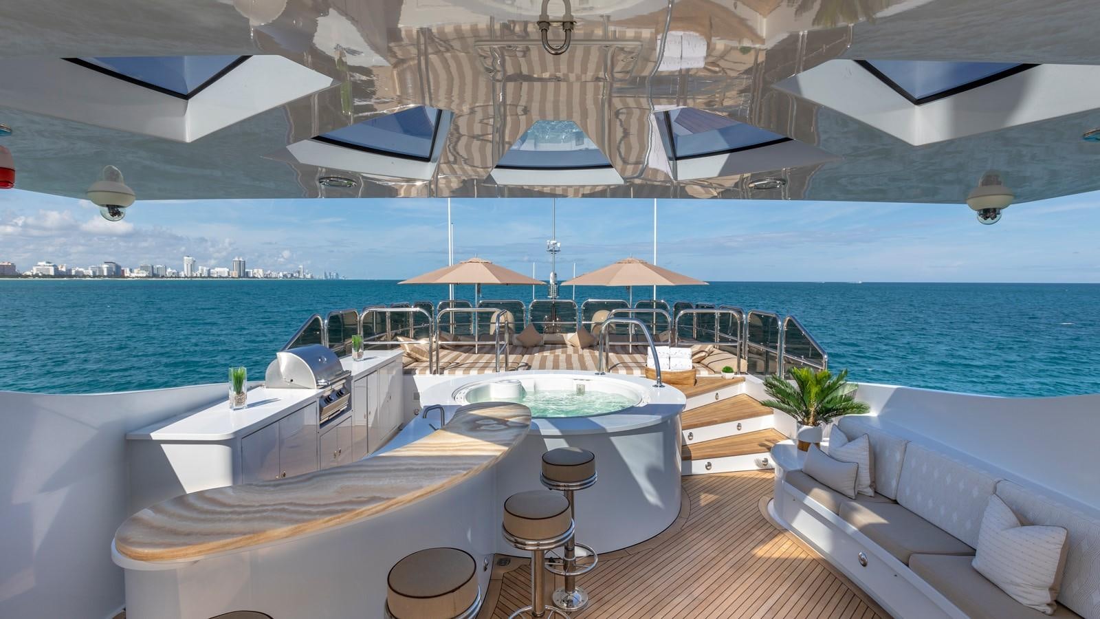 a room with a table and chairs aboard GLAZE Yacht for Sale
