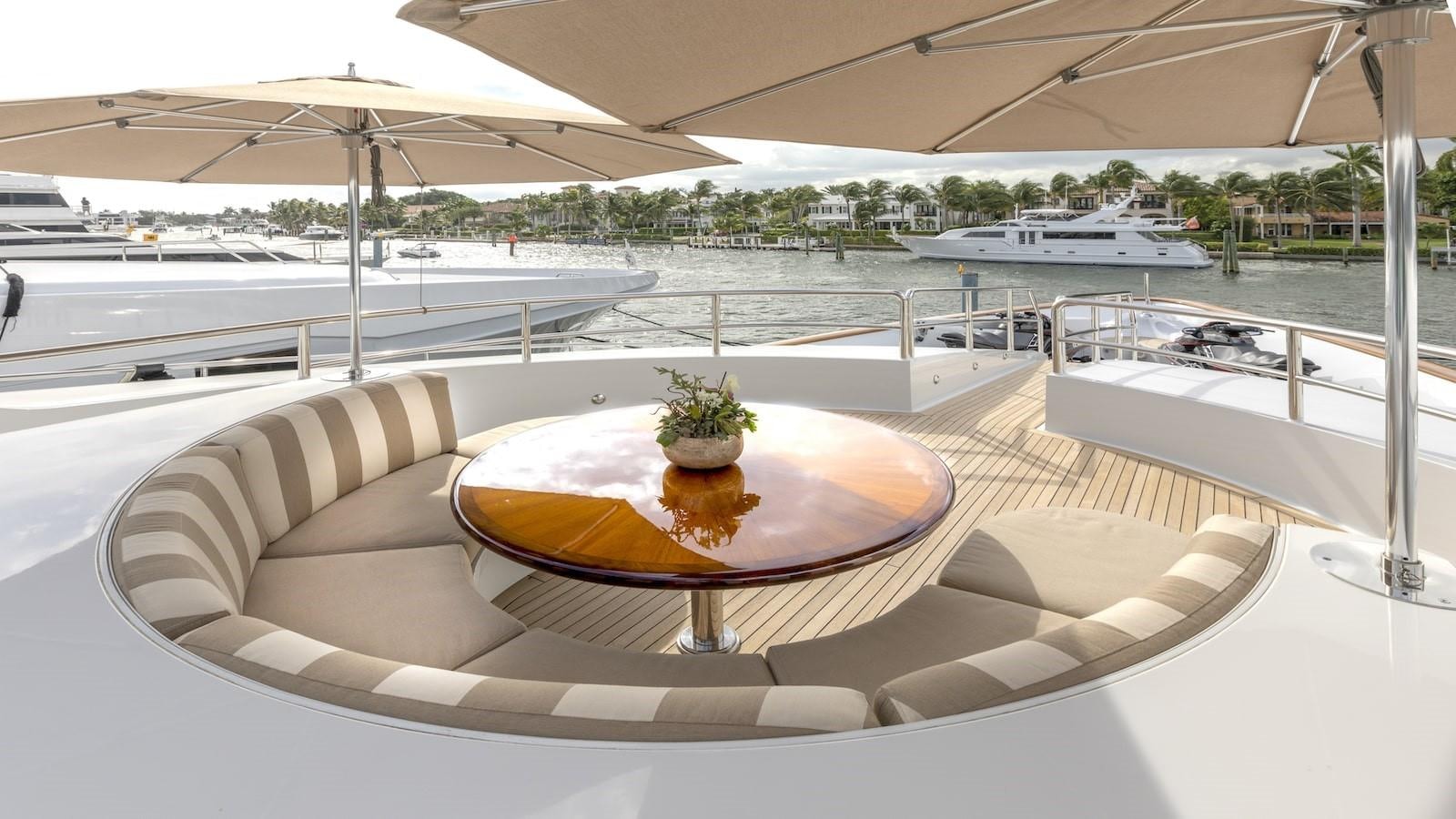 a large lounge area with a plant on it aboard GLAZE Yacht for Sale