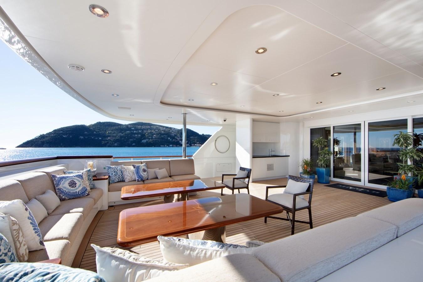 a living room with a large open roof aboard OLMIDA Yacht for Sale