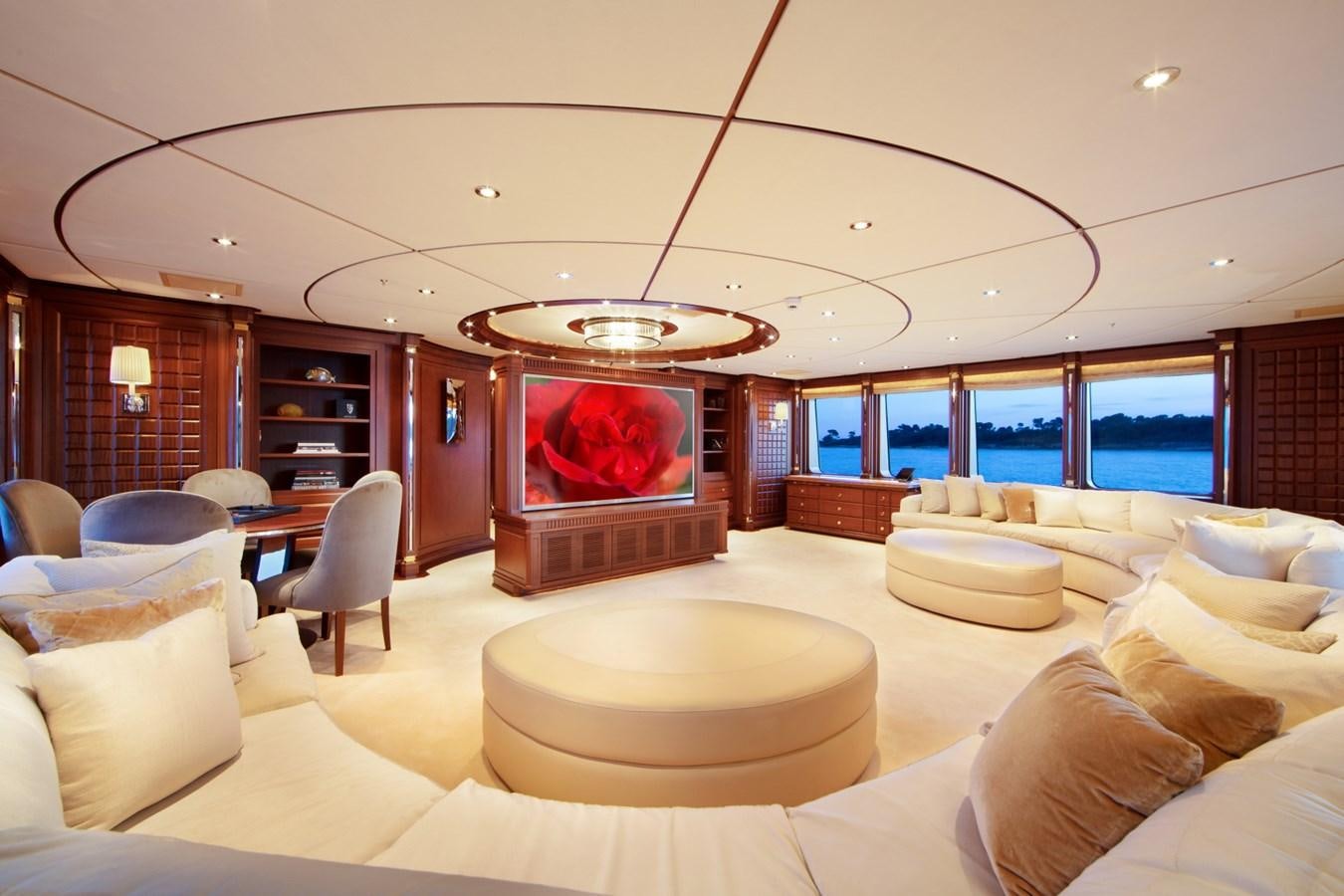 a living room with a fireplace aboard OLMIDA Yacht for Sale