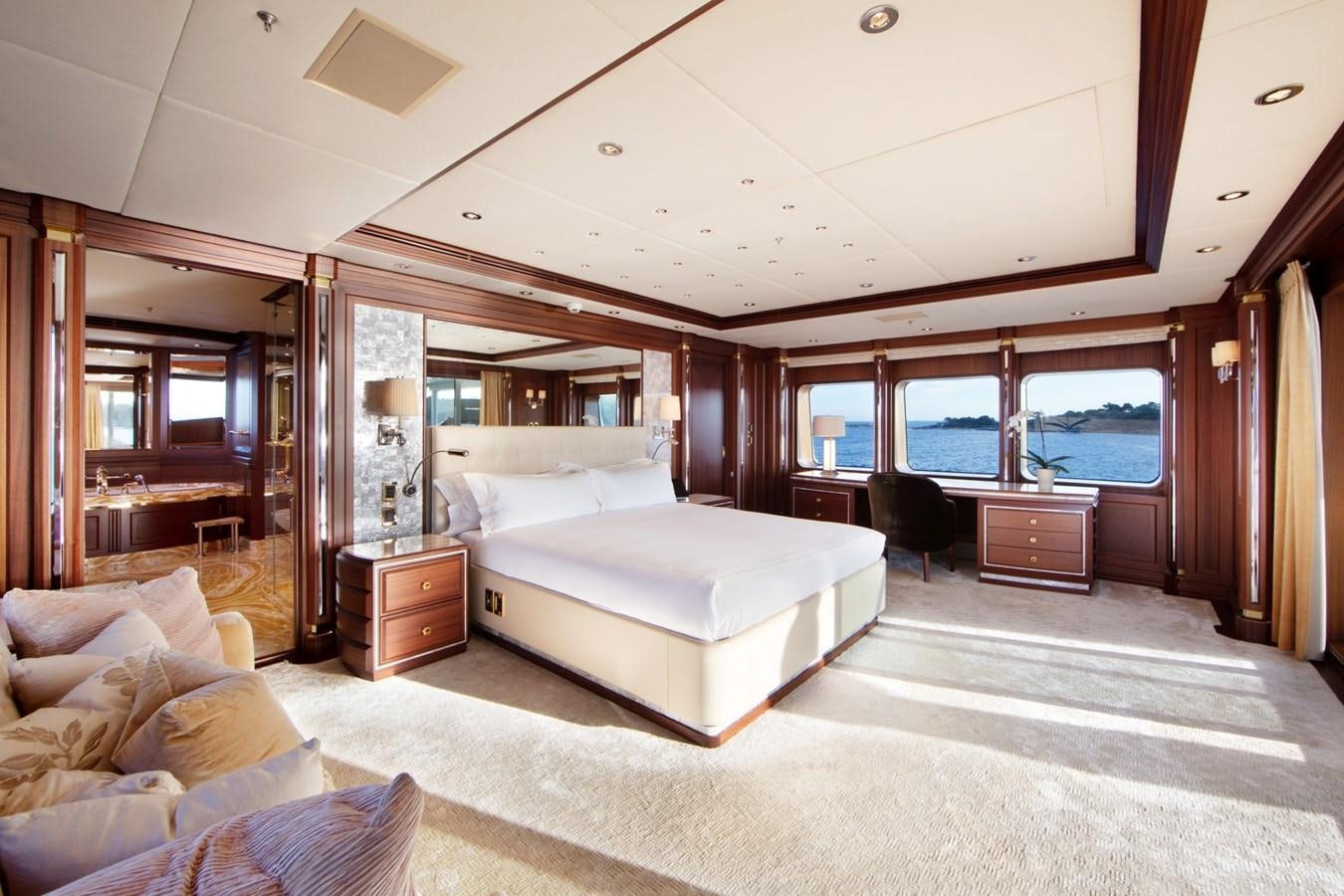 a large bedroom with a large bed aboard OLMIDA Yacht for Sale