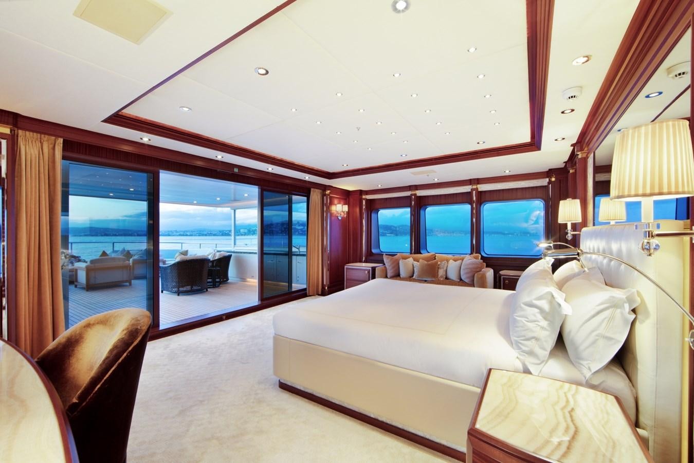 a large bedroom with a large bed aboard OLMIDA Yacht for Sale
