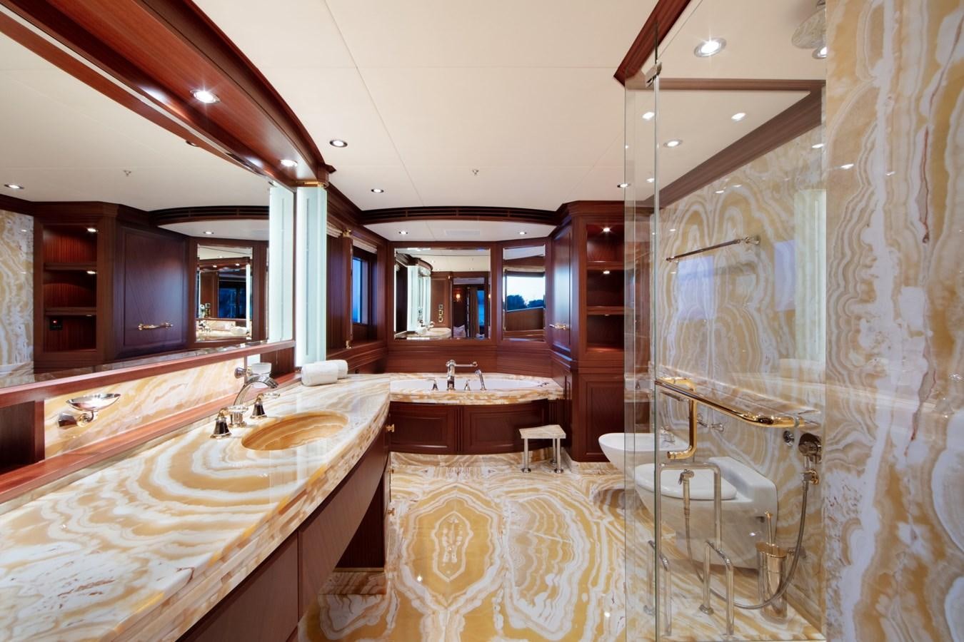 a bathroom with a large mirror aboard OLMIDA Yacht for Sale