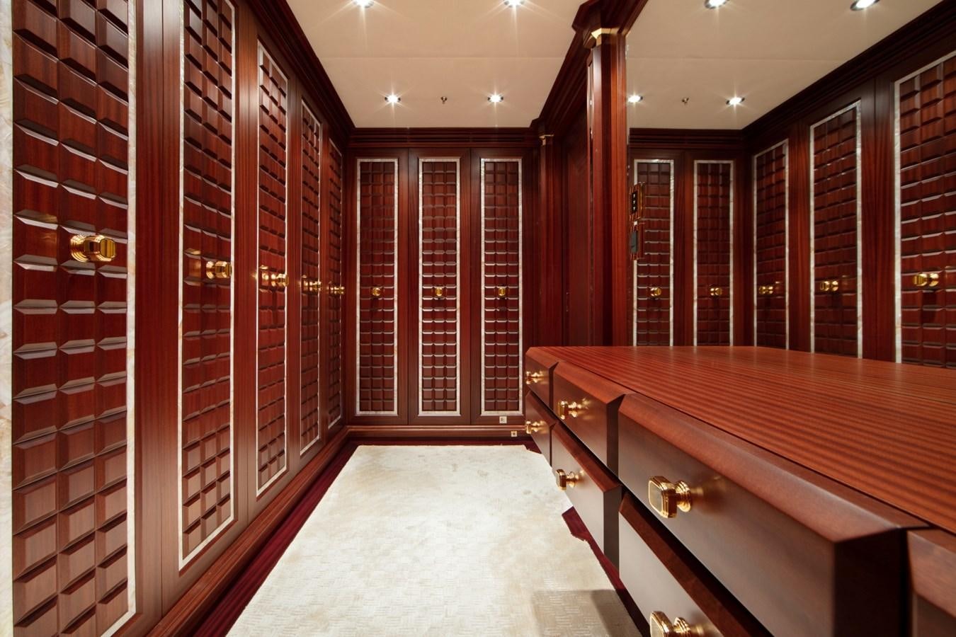 a room with red walls aboard OLMIDA Yacht for Sale