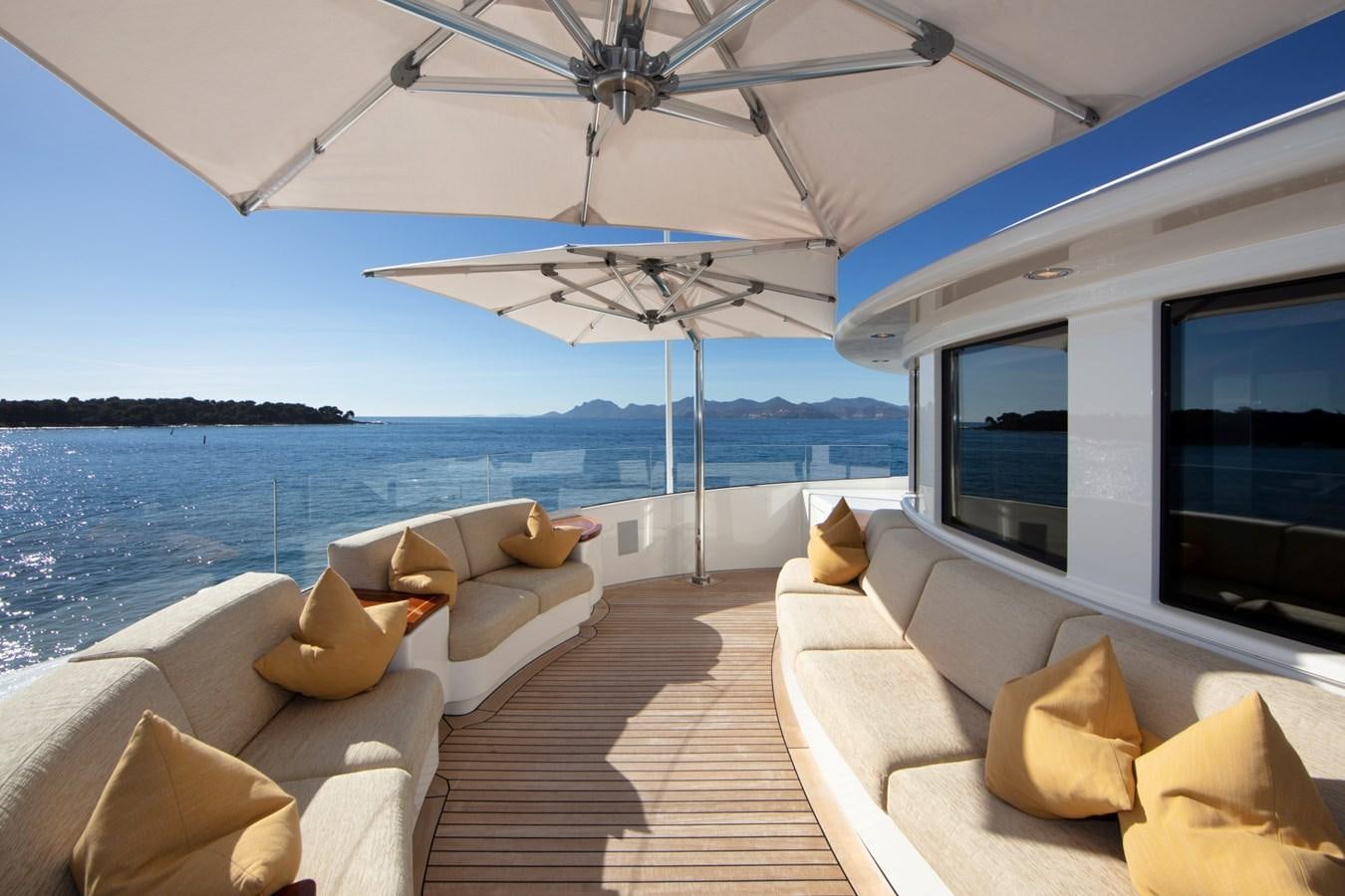 a large living room with a large body of water aboard OLMIDA Yacht for Sale