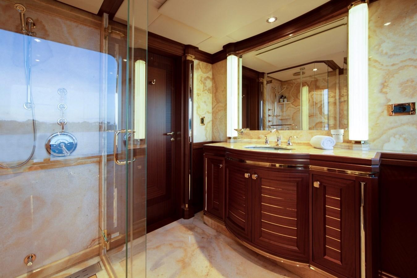 a bathroom with a shower and sink aboard OLMIDA Yacht for Sale