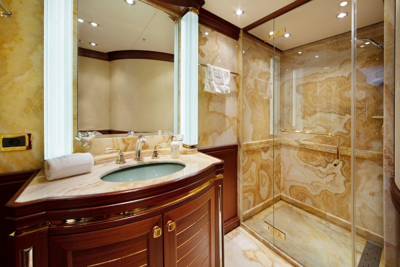 a bathroom with a glass shower aboard OLMIDA Yacht for Sale